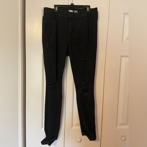 Women’s black skinny jeans with rips